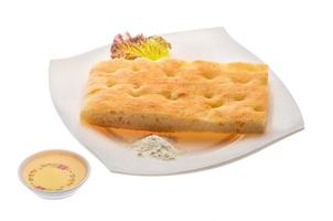 Olive bread on the plate and white background photo