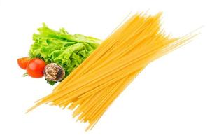 Raw spaghetti on white background photo