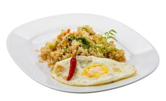Fried rice with egg on the plate and white background photo