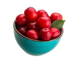 Damson plum in a bowl on white background photo