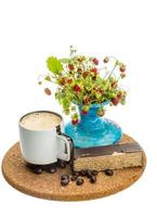 Coffee with cake on wooden board and white background photo