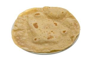 Chapati in a basket on white background photo