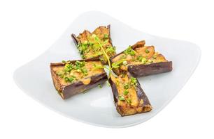 Grilled eggplant on the plate and white background photo