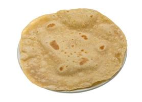 Chapati in a basket on white background photo