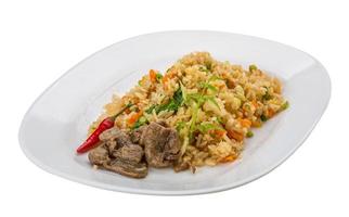 Fried rice with beef on the plate and white background photo