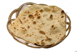 Plain Naan in a basket on white background photo