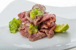 Beef carpaccio on the plate photo