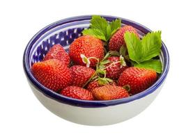 Ripe strawberry in a bowl on white background photo