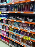 Jombang, East Java, Indonesia, 2022 - Rows of perfume shelves in supermarkets from various well-known brands in Indonesia. portrait of perfume display in shopping mall. photo