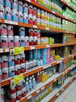 Jombang, East Java, Indonesia, 2022 - Rows of shelves in supermarkets contain rows of canned drinks that are halal from various well-known brands in Indonesia. photo