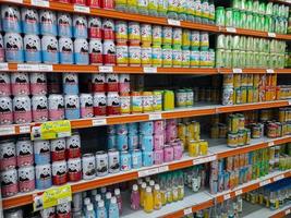 Jombang, East Java, Indonesia, 2022 - Rows of shelves in supermarkets contain rows of canned drinks that are halal from various well-known brands in Indonesia. photo