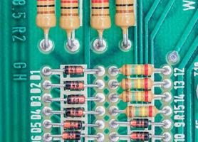 Condensers and Resistor assembly on the circuit board photo