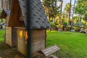 wooden cat house in the garden photo