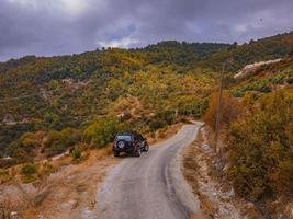 A forest road with on a beautiful autumn day photo