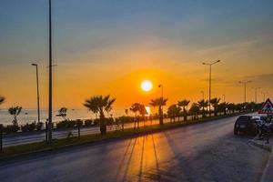 Calm sea with sunset sky and sun over clouds. Meditation ocean and sky background. photo