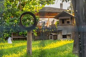 wooden cat house in the garden photo