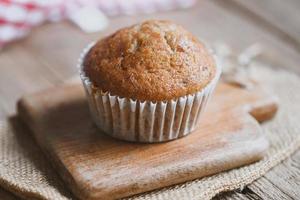 Banana Cake on wooden background, delicious sweet dessert cupcakes food or snack photo