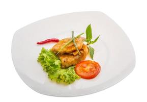 Baracuda steak on the plate and white background photo