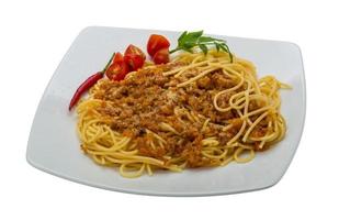 Bolognese spaghetti on the plate and white background photo