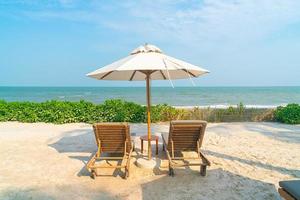 umbrella with beach chair and ocean sea background photo