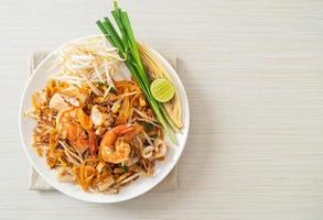 Pad Thai Seafood - Stir fried noodles with shrimps, squid or octopus and tofu photo