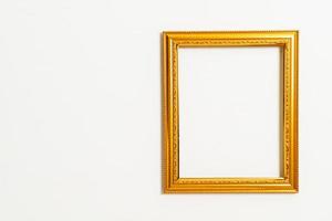 empty picture frame on white wall background photo