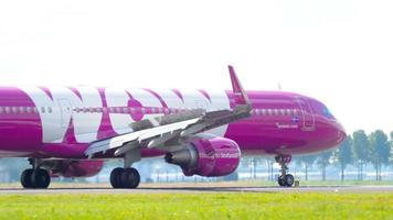 AMSTERDAM, THE NETHERLANDS JULY 26, 2017 - WOW Air Airbus 321 TF JOY braking after landing on runway 18R Polderbaan. Shiphol Airport, Amsterdam, Holland video