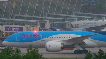 PHUKET, THAILAND DECEMBER 3, 2016 - Thomson Boeing 787 Dreamliner G TUIF taxiing after landing in Phuket airport at early morning. View from the top floor of the hotel video