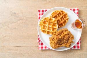 fried chicken waffle with honey or maple syrup photo