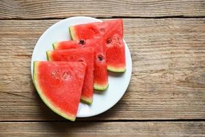 Watermelon slice on white plate background, Closeup sweet watermelon slices pieces fresh watermelon tropical summer fruit photo