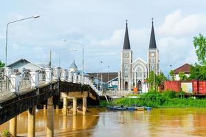 Cathedral of the Immaculate Conception with Niramon bridge at Chanthaburi in Thailand photo