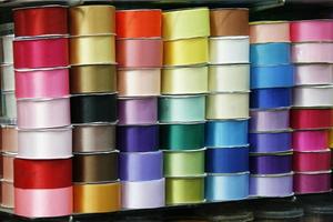 colorful ribbon rolls on shelf photo