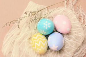 Pastel and colorful easter eggs on cloth with copy space, happy easter holiday concept photo