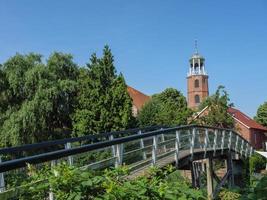 ditzum,germany,2020-the small village of ditzum at the river ems in germany photo