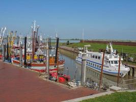 ditzum,germany,2020-the small village of ditzum at the river ems in germany photo