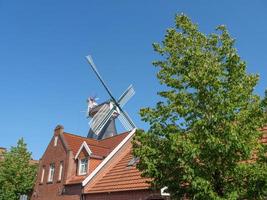 ditzum,germany,2020-the small village of ditzum at the river ems in germany photo