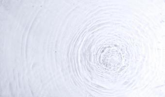 abstract ripples water texture in top view. pure water ripple animations for beautiful backgrounds. minimalist and clean liquid overlay photo