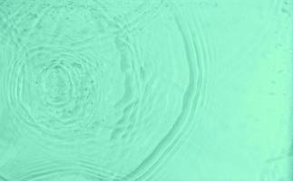 abstract ripples water texture in top view. pure water ripple animations for beautiful backgrounds. minimalist and clean liquid overlay photo