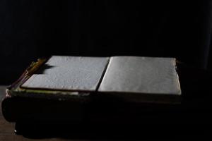 a collection of old books that are weathered in piles. vintage and retro theme backgrounds photo