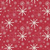 Seamless Christmas snowflake pattern. Seamless vector white snowflakes of different sizes on red background for fabric or wrapping paper print.