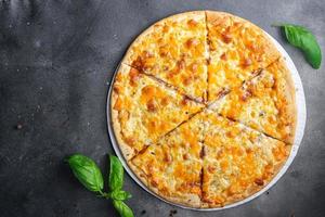 cheesy pizza types of cheese dish healthy meal food snack on the table copy space food background photo