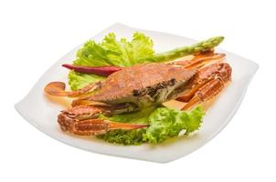 Boiled crab on the plate and white background photo