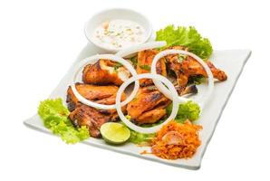 Tandori Chicken on the plate and white background photo