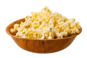 Popcorn in a bowl on white background photo