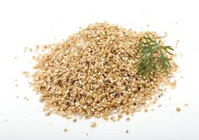 Pearl barley on white background photo