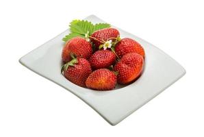 Ripe strawberry in a bowl on white background photo