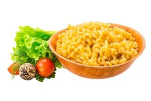 Fusilli pasta in a bowl on white background photo