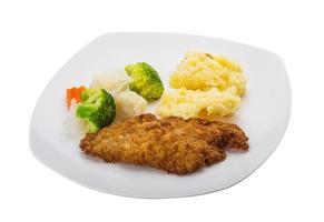 schnitzel on the plate and white background photo
