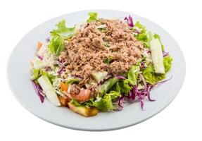 Tuna salad on the plate and white background photo