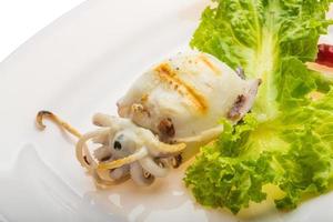 Grilled cuttlefish on the plate photo